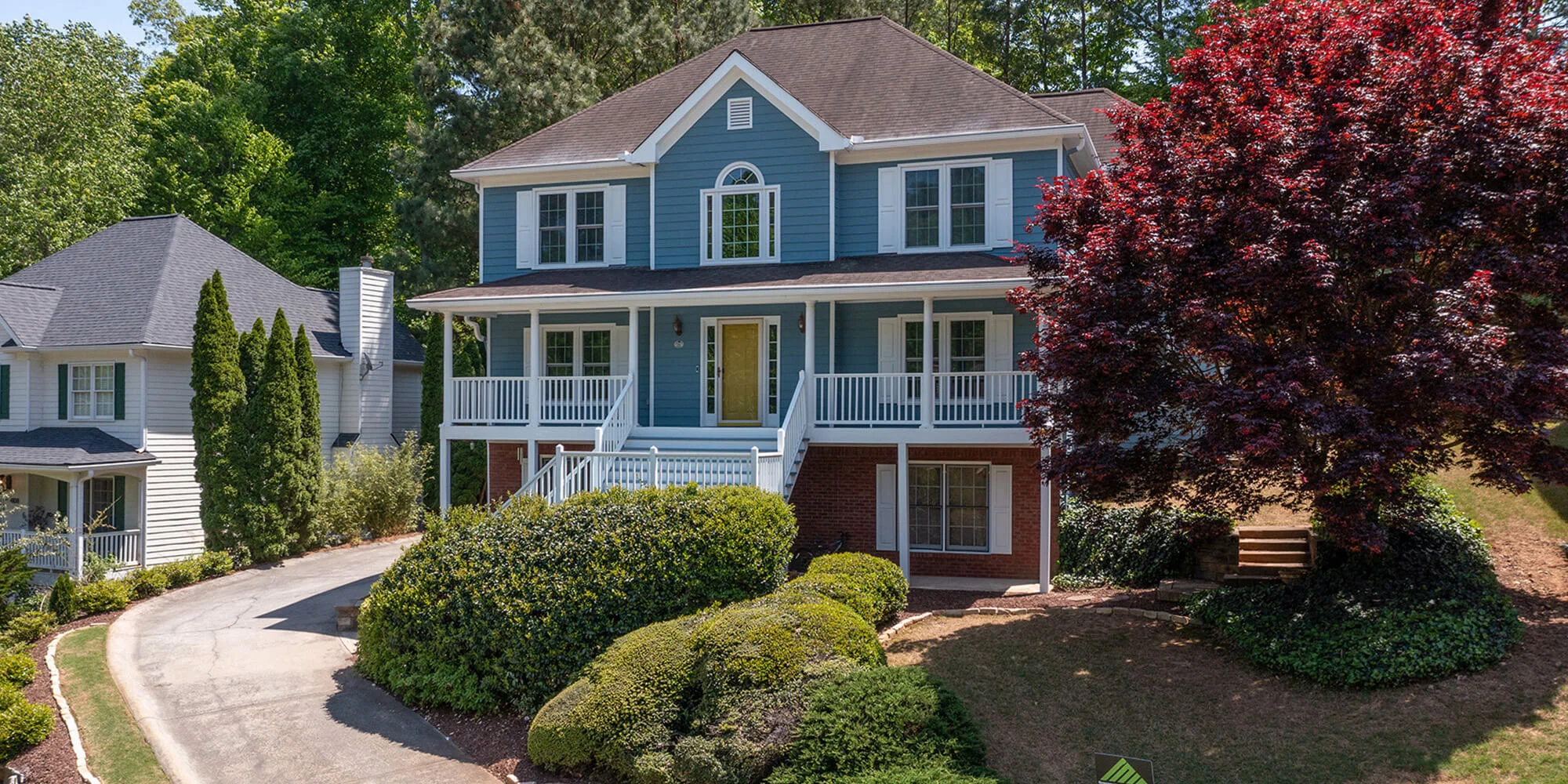 beautiful home with blue siding